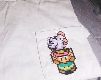 link holding a chicken pocket tee
