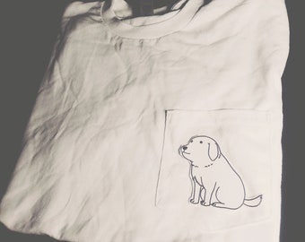 May include: White t-shirt with a black and white illustration of a dog in the pocket.