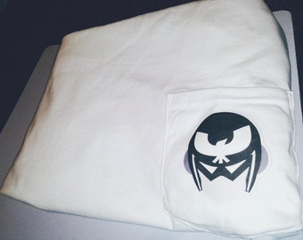 May include: White t-shirt with a black and white graphic of a masked figure with a bird on the chest in the pocket.