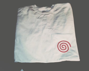 May include: White t-shirt with a red spiral logo on a pocket.