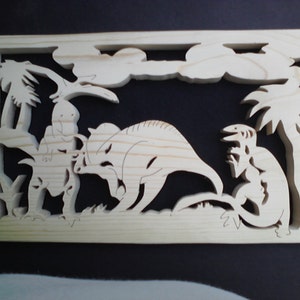 May include: A wooden wall art piece depicting three dinosaurs in a jungle setting. The dinosaurs are carved in relief and are surrounded by palm trees and clouds.