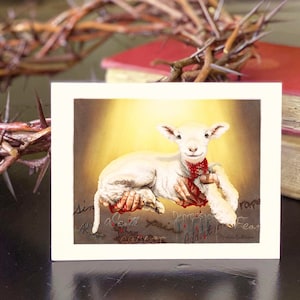 May include: A white lamb with a red wound on its neck is held in the hands of a person. The lamb is surrounded by a bright light. The words "sin", "death", "pain", "depression", "fear", "addiction", and "cancer" are written around the lamb. The words are written in red and are connected to the wound on the lamb's neck.