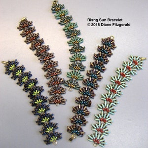 May include: Four beaded bracelets with a sunburst design. The bracelets are in shades of green, blue, orange, and red.