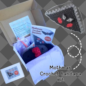 May include: A Mothman crochet bandana kit in a cardboard box containing yarn in black, red, and grey, a 4.5 mm crochet hook, scissors, stitch markers, a tapestry needle, and a printed pattern booklet titled Mothman Crochet Bandana.