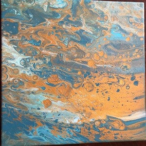 May include: Abstract acrylic painting on canvas with a fluid design. The artwork features a blend of blue, gold, and white hues, creating a marbled effect. The colors swirl and mix, forming organic shapes and patterns. The painting is a square format.