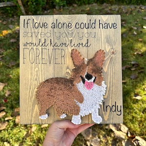 May include: A wooden sign with a string art image of a corgi dog. The sign reads "If love alone could have saved you, you would have lived FOREVER" and is signed "Indy".