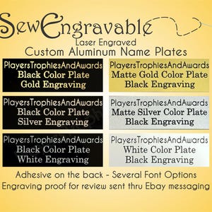 May include: Six rectangular aluminum name plates with adhesive backing, displayed in two columns. The plates feature laser-engraved text in black, gold, silver, and white finishes on black, gold, silver, and white backgrounds with custom text.