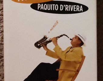 Mi vida de saxofón de Paquito D' Rivera, 1.ª edición, 1.ª impresión, firmada por Paquito D' Rivera 2005. Una autobiografía.