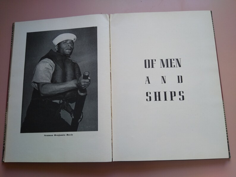 May include: A black and white photograph of a man in a sailor's uniform holding a life preserver. The caption below the photo reads "Seaman Benjamin Davis". The title of the book is "OF MEN AND SHIPS".