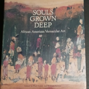 May include: Book cover with a painting of a group of people in a forest. The title of the book is "Souls Grown Deep: African American Vernacular Art".