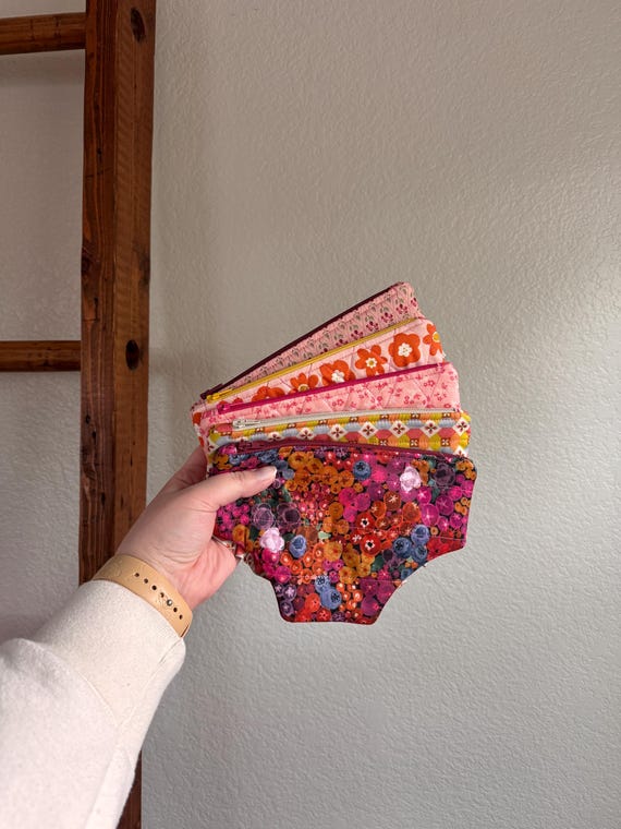 A zippered pouch literally shaped and quilted like a pair of underwear — it's a functional bag that doubles as a perfectly awkward thing to pull out of your purse.