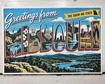 May include: A rectangular postcard featuring the text Greetings from MISSOURI and THE SHOW-ME STATE. The letters contain illustrations of Route 66, the Gateway Arch, a capitol building, a waterfall, a farm, and a river landscape with trees.