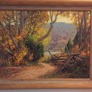 May include: A painting of a forest scene with a wooden fence in the foreground. The trees are in autumn colors, with yellow, orange, and red leaves. The background shows a distant mountain range.