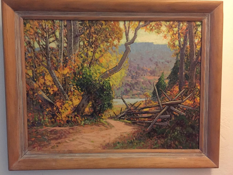 May include: A painting of a forest scene with a wooden fence in the foreground. The trees are in autumn colors, with yellow, orange, and red leaves. The background shows a distant mountain range.