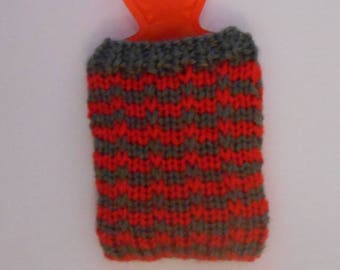 Water bottle pocket heater covered with handmade knitted cover