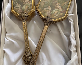 Vintage Vanity dresser set with matching hairbrush and beveled hand mirror. Gold filigree metal, decorative, French style print 1930-1950