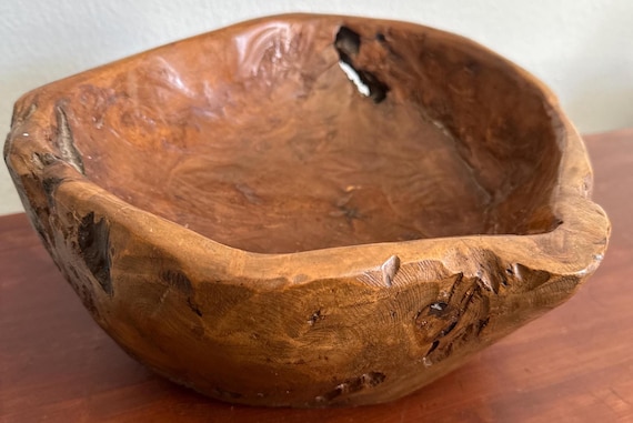 A hand-carved organic root bowl — no two are alike, and the raw sculptural beauty of live-edge wood makes it feel more like art than kitchenware.