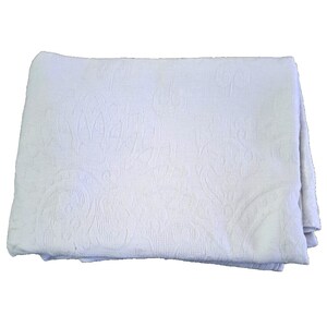 May include: White cotton blanket with an embossed floral pattern.