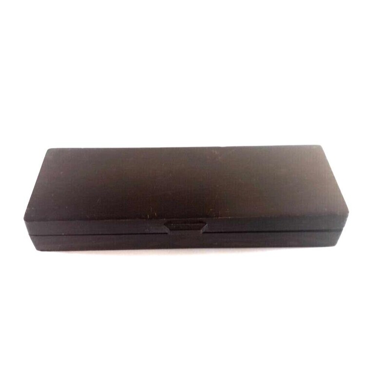 May include: A dark brown wooden box with a hinged lid. The box is closed and appears to be empty.