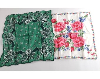May include: Two vintage handkerchiefs, one green with a floral pattern and the other white with pink roses and blue flowers.