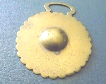 Antique stamped HORSE BRASS with Raised Central Sun Disc Flash in Solid Border REF191
