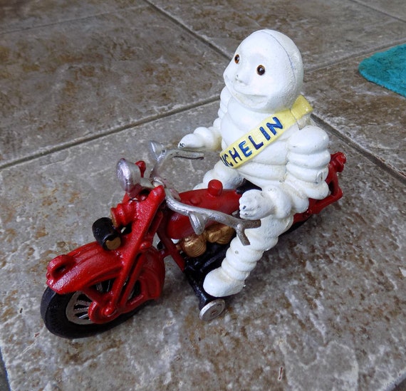 Michelin Man Bibendum on Red Motorcycle Vintage Cast Iron Toy 