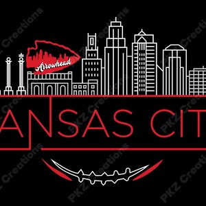 May include: Black graphic design featuring a Kansas City skyline in white and red. The word "KANSAS CITY" is displayed in red, with an arrowhead and a football-shaped design at the top and bottom. The design is on a black background.