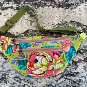 Ferris Fanny Pack full of fun and function. Two exterior zippered pockets. Tula Pink Moon Garden fabric. Beautiful hardware and trim.