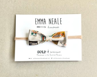 Stone Bow in World Traveller Print.  World Stamp Bow.  Baby Jet Setter Bow on Nylon Band. Super Soft Toddler Bow. Lux Baby Gift Handmade Bow