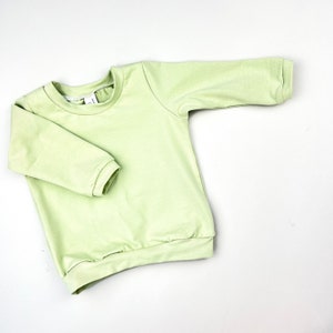 Pastel Lime Long Sleeve Baby T-Shirt. Warm Green Baby Tee shirt. Handmade Toddler Gift. Unisex Baby T-Shirt. Sweater Style Top for Baby
