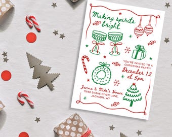 May include: A white Christmas party invitation with red and green illustrations of ornaments, a wreath, a candy cane, glasses, a gift box, and a Christmas tree. The text reads "Making spirits bright" and "You're invited to a Christmas party! December 12 at 5pm". The invitation also includes the address "Jenna & Mike's House, 11930 Snake River Lane, Jackson, WY".