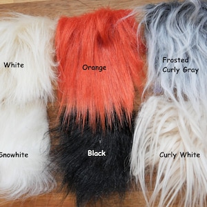 May include: Six swatches of faux fur in different colors and textures. The swatches are labeled "White", "Snowhite", "Orange", "Black", "Frosted Curly Gray", and "Curly White".