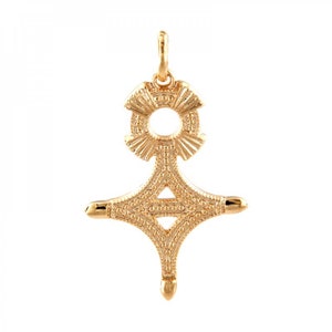May include: A gold pendant in the shape of a cross with a circle at the top. The cross is decorated with a textured pattern.