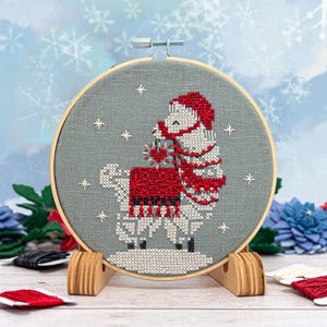 Snowflake Llama Ornament cross stitch pattern stitched model.