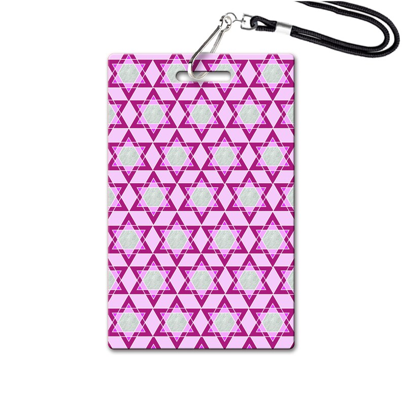 May include: A pink and white patterned lanyard with a star of David design. The lanyard has a silver clip and a black strap.
