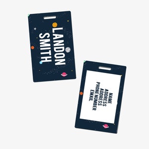 May include: Two blue and black space-themed name tags with planets and stars. The first tag says "LANDON SMITH". The second tag has fields for "NAME", "ADDRESS", "PHONE NUMBER", and "EMAIL".