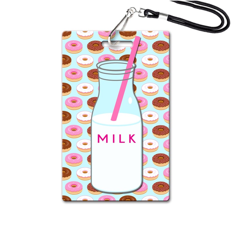 May include: A blue and white ID badge with a milk bottle and pink straw on a background of pink and brown donuts. The milk bottle has the word "MILK" printed on it.
