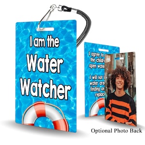 May include: A blue and white lanyard with a red life preserver graphic and the text "I am the Water Watcher". The back of the lanyard has a photo placeholder with the text "Optional Photo Back".