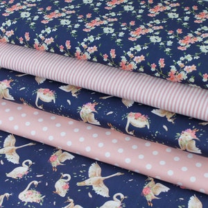 May include: Five fabric swatches in different patterns. The top swatch is a navy blue fabric with a white and pink floral print. The second swatch is a pink and white striped fabric. The third swatch is a navy blue fabric with a white polka dot pattern. The fourth swatch is a navy blue fabric with a white and pink floral print featuring swans. The bottom swatch is a navy blue fabric with a white and pink floral print featuring swans.