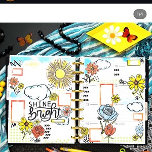 May include: A weekly planner with a bright yellow sun, clouds, and flowers drawn on the pages. The text "Shine Bright" is written in black marker on the left page. The planner is open to the week of March 10th.