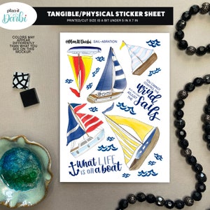 May include: A sticker sheet featuring watercolor illustrations of sailboats in various colors, including yellow, blue, and red. The sheet includes the text "What life is all a boat" and "You cannot control the wind but you can adjust the sails". The printed/cut size is a bit under 5 in x 7 in.