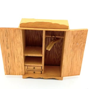 Vintage Wooden Miniature Dollhouse Wardrobe with Two Movable Drawers and Hangers.