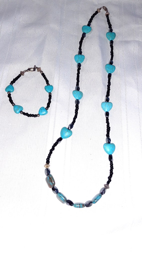 Turquoise stone and black Gem