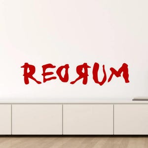 May include: Red wall decal with the word "REDRUM" written in a backwards, stylized font.