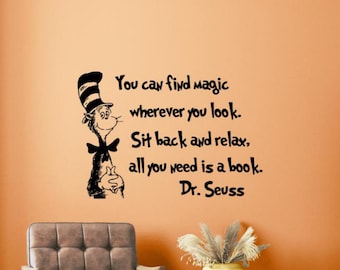 May include: Black and white wall decal featuring the Cat in the Hat character from Dr. Seuss. The quote reads "You can find magic wherever you look. Sit back and relax, all you need is a book. Dr. Seuss."
