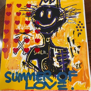 May include: A colorful abstract art print with a black and purple figure wearing a crown. The figure has a large smile and the words "Summer of Love" are written in blue at the bottom. The background is yellow with red hearts and black dots.