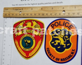 2 Long Island NY decals Nassau county and suffolk county police. Inside window sticker