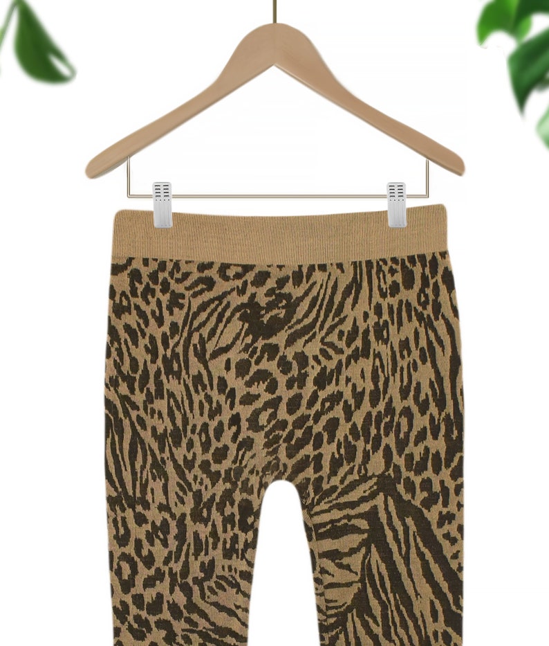 May include: Brown and black animal print leggings with a wide waistband.