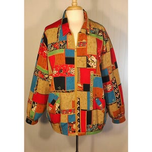 May include: A colorful patchwork jacket with a zipper closure. The jacket features a variety of floral and geometric patterns in shades of red, blue, green, black, and brown.