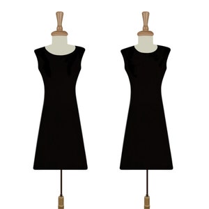 May include: Two black sleeveless dresses on mannequins with wooden heads and bases.